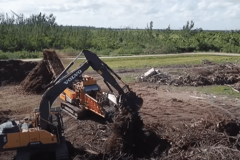 CBI 6800CT Horizontal Grinder Processing Storm Debris