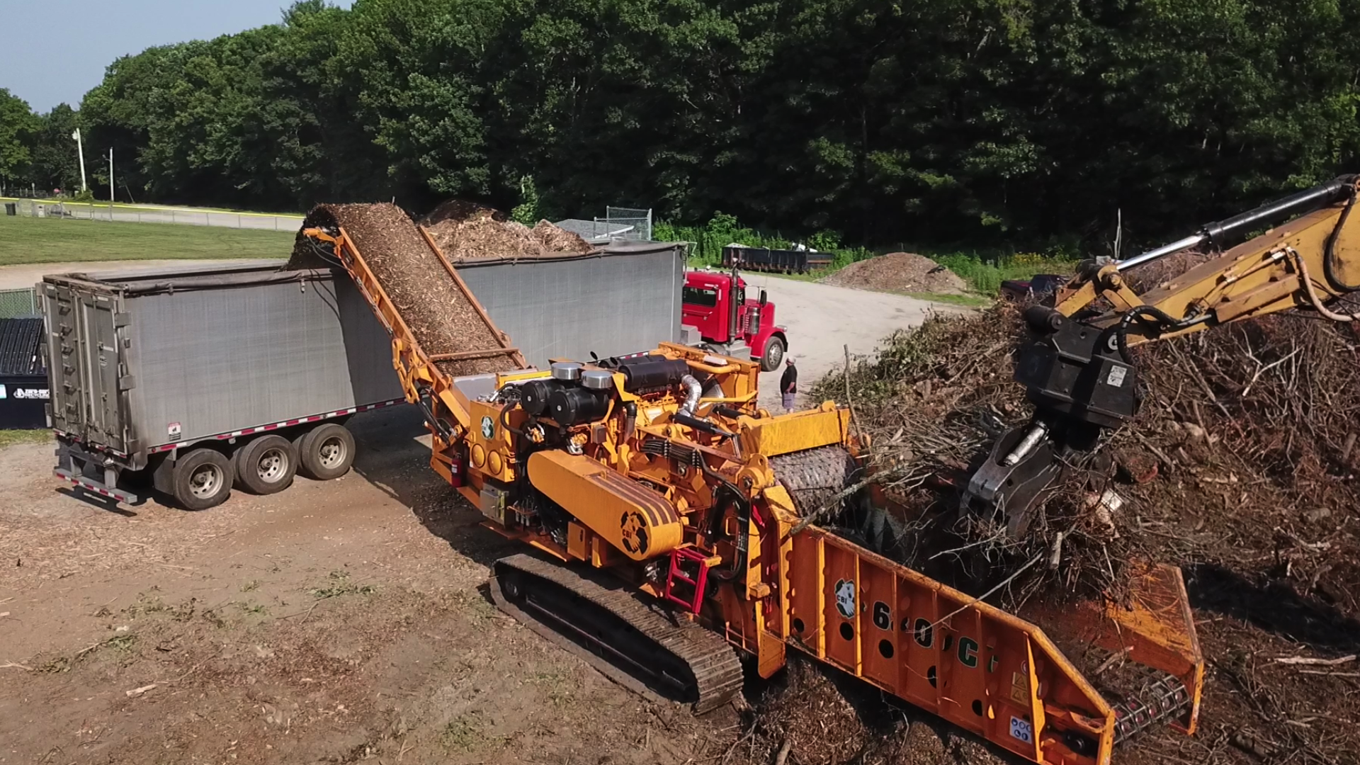 CBI 6800CT Horizontal Grinder Processing Storm Debris